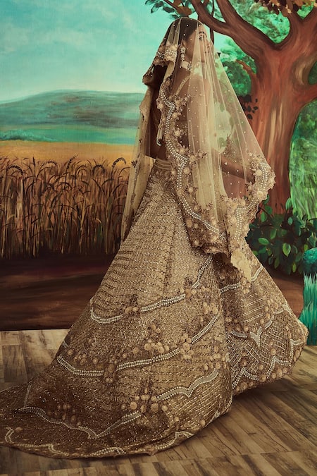 Shop Angad Singh Gold Dupatta Net, Lehenga And Blouse Organza Embroidered Trail Bridal Set at Aza Fashions Shop_Angad Singh_Gold Dupatta Net, Lehenga And Blouse Organza Embroidered Trail Bridal Set _at_Aza_Fashions