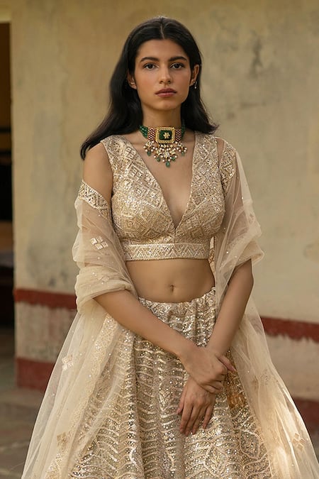 Angad Singh Gold Net Lining Satin V Neck Embroidered Bridal Lehenga Set Online at Aza Fashions Angad Singh_Gold Net Lining Satin V Neck Embroidered Bridal Lehenga Set _Online_at_Aza_Fashions