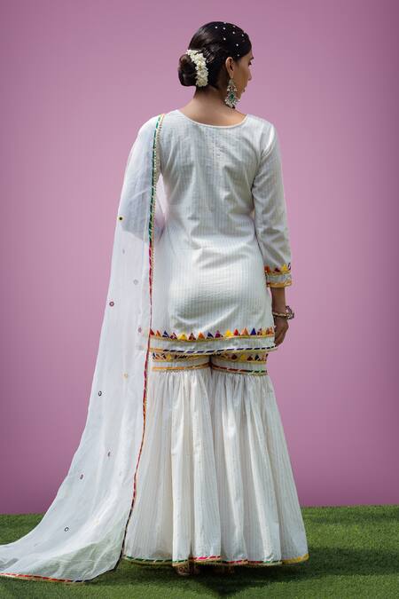 Shop Rivaaj Clothing White Stripe Pattern Kurta Gharara Set at Aza Fashions Shop_Rivaaj Clothing_White Stripe Pattern Kurta Gharara Set _at_Aza_Fashions