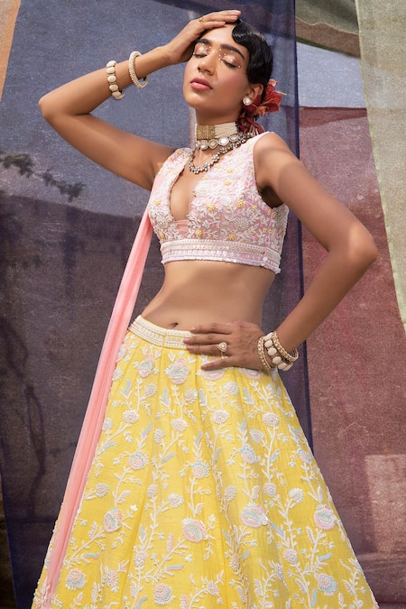 Yellow Patola lehenga with cutwork dupatta and pink hand embroidered blouse.  | Instagram