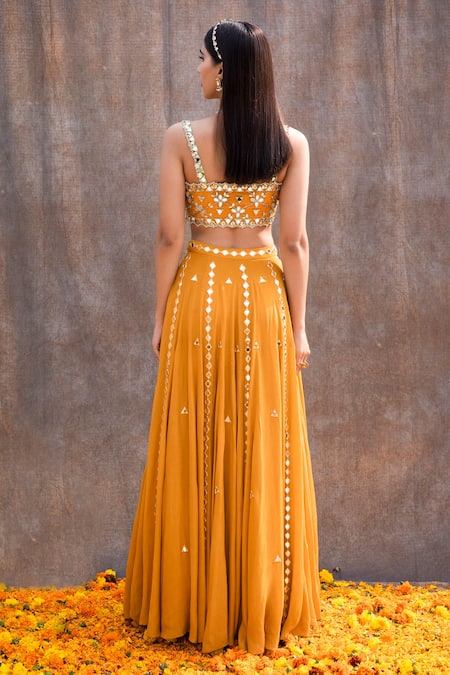 Shop_Silky Bindra_Yellow Net, Crepe, Shantoon Mirror, Nakshi Scoop Embellished Bridal Lehenga Set _at_Aza_Fashions