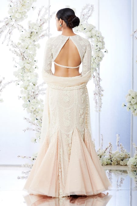 Shop_Seema Gujral_Peach Net Floral Round Embroidered Fish Cut Lehenga Set _at_Aza_Fashions