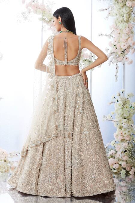 Shop_Seema Gujral_Beige Net Crystal, Sequin Plunge Floral Embroidered Bridal Lehenga Set_at_Aza_Fashions