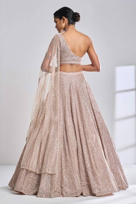 Shop Seema Gujral Gold Net Sequin, Pearl And Beads One Shoulder Blouse & Lehenga Set at Aza Fashions Shop_Seema Gujral_Gold Net Sequin, Pearl And Beads One Shoulder Blouse & Lehenga Set_at_Aza_Fashions