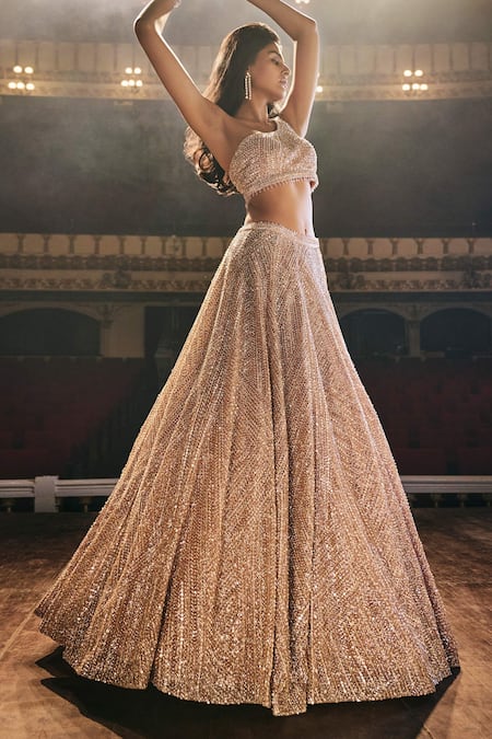 Seema Gujral Gold Net Sequin, Pearl And Beads One Shoulder Blouse & Lehenga Set Online at Aza Fashions Seema Gujral_Gold Net Sequin, Pearl And Beads One Shoulder Blouse & Lehenga Set_Online_at_Aza_Fashions