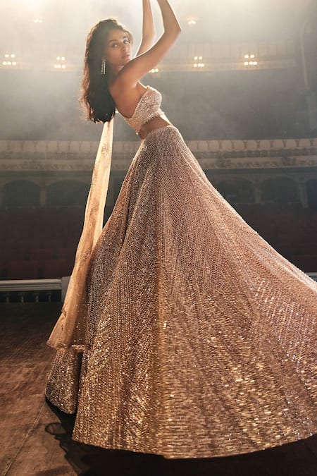 Buy Seema Gujral Gold Net Sequin, Pearl And Beads One Shoulder Blouse & Lehenga Set Online at Aza Fashions Buy_Seema Gujral_Gold Net Sequin, Pearl And Beads One Shoulder Blouse & Lehenga Set_Online_at_Aza_Fashions