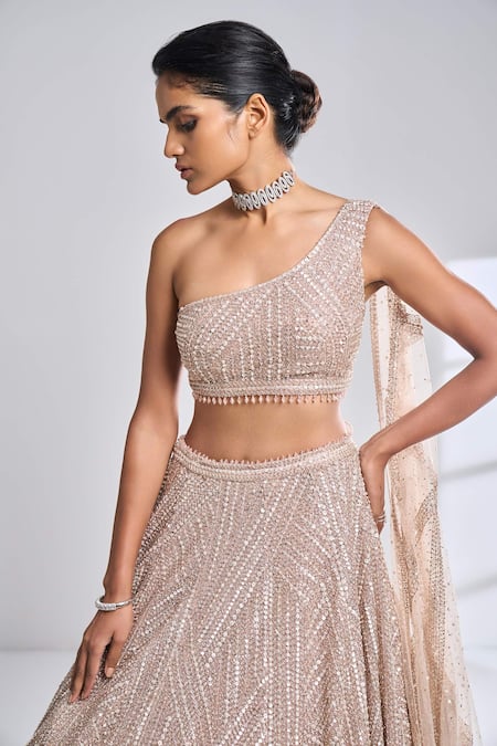 Seema Gujral Gold Net Sequin, Pearl And Beads One Shoulder Blouse & Lehenga Set at Aza Fashions Seema Gujral_Gold Net Sequin, Pearl And Beads One Shoulder Blouse & Lehenga Set_at_Aza_Fashions