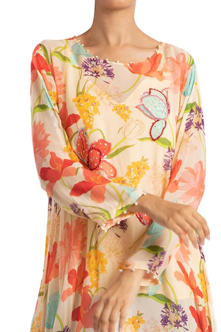 Shop Seams Pret And Couture Multi Color Georgette Floral Motifs Round Printed Asymmetric Tunic at Aza Fashions Shop_Seams Pret And Couture_Multi Color Georgette Floral Motifs Round Printed Asymmetric Tunic _at_Aza_Fashions