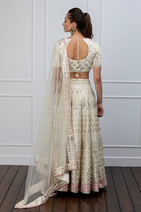 Shop Shian White Dupion Silk Pearl Round Leather Embellished Lehenga Set at Aza Fashions Shop_Shian_White Dupion Silk Pearl Round Leather Embellished Lehenga Set _at_Aza_Fashions