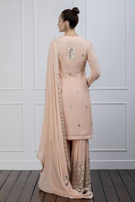 Shop Shian Peach Georgette Mirror Work Notched Embroidered Gharara Set at Aza Fashions Shop_Shian_Peach Georgette Mirror Work Notched Embroidered Gharara Set _at_Aza_Fashions