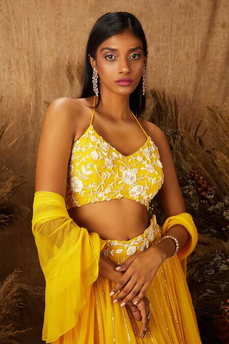 Shloka Khialani_Yellow Net, Crepe, Georgette Halter Embroidered Lehenga Set _Online_at_Aza_Fashions