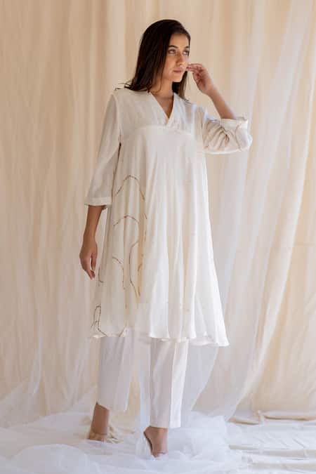 Shop Nirjara White Kurta And Pants Cotton Silk V Neck Embroidered & Set at Aza Fashions Shop_Nirjara_White Kurta And Pants Cotton Silk V Neck Embroidered & Set _at_Aza_Fashions