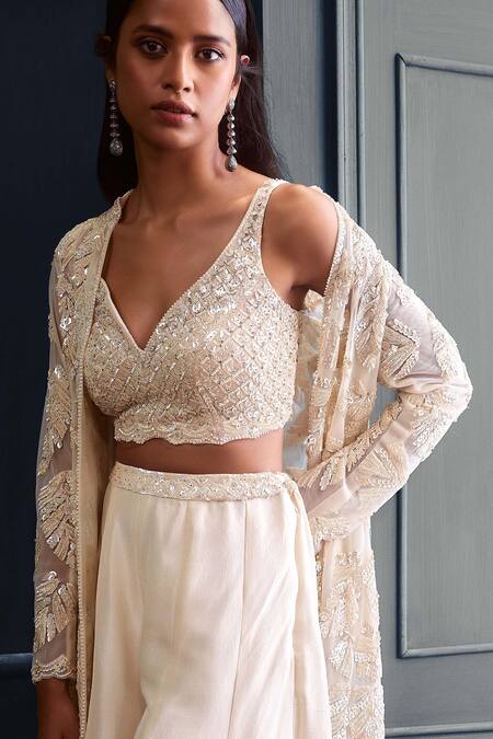 Buy Seema Gujral Ivory Raw Silk, Net Sequin And Crystal Embellished Long Jacket & Flared Pant Set Online at Aza Fashions Buy_Seema Gujral_Ivory Raw Silk, Net Sequin And Crystal Embellished Long Jacket & Flared Pant Set_Online_at_Aza_Fashions