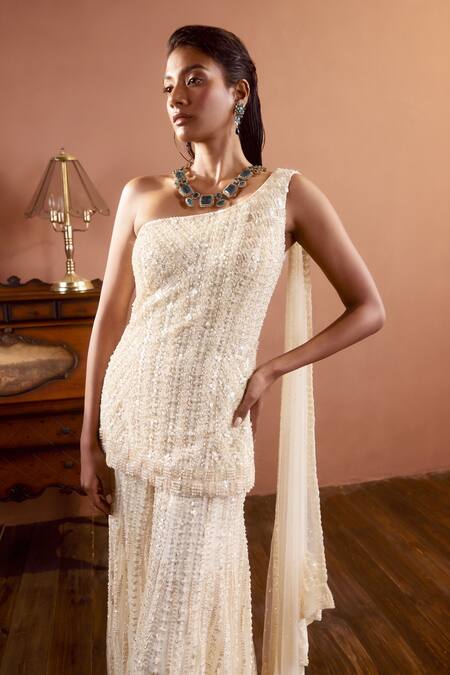 Seema Gujral Ivory Net Metallic Sequins One Shoulder Draped Kurta And Sharara Set Online at Aza Fashions Seema Gujral_Ivory Net Metallic Sequins One Shoulder Draped Kurta And Sharara Set_Online_at_Aza_Fashions