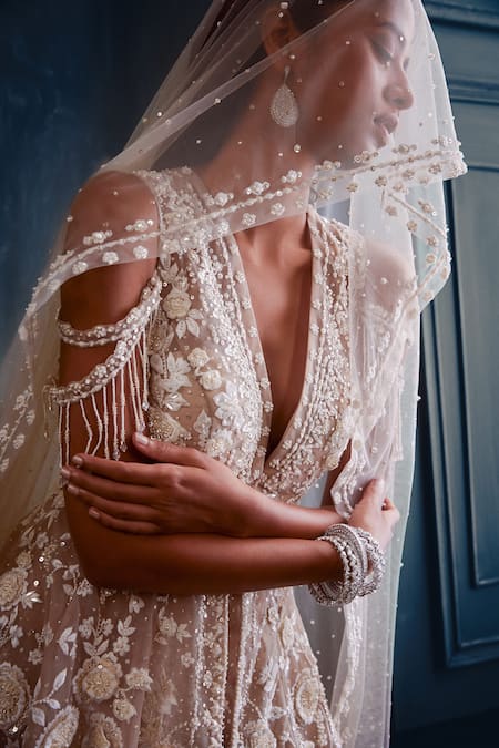 Seema Gujral_Beige Net 3d Floral Motifs Plunge V Neck Embroidered Kurta Sharara Set _at_Aza_Fashions