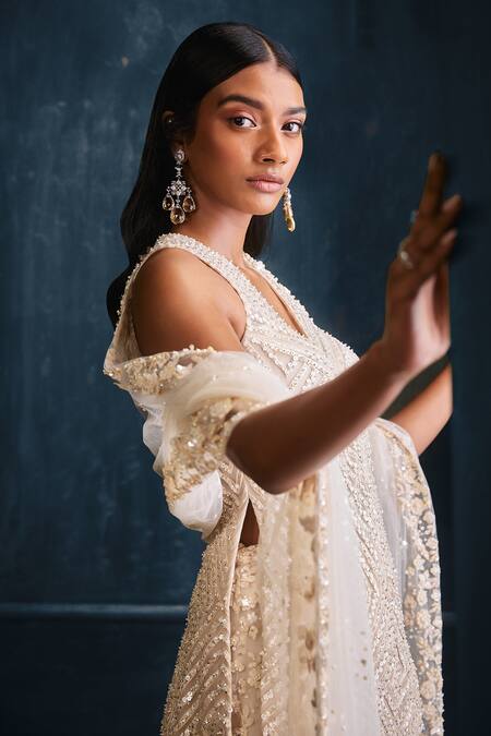 Seema Gujral_Ivory Net 3d Floral Motifs V Neck Embroidered Kurta Sharara Set_at_Aza_Fashions