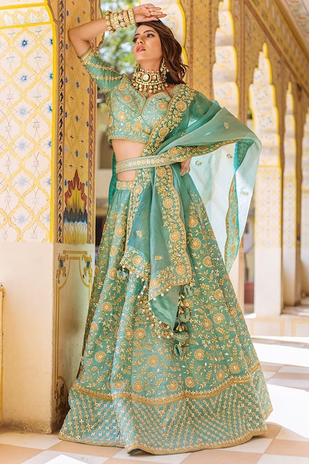 Shop Surbhi Shah Blue Organza, Pure Raw Silk Floral Motifs V Neck Embroidered Bridal Lehenga Set at Aza Fashions Shop_Surbhi Shah_Blue Organza, Pure Raw Silk Floral Motifs V Neck Embroidered Bridal Lehenga Set _at_Aza_Fashions