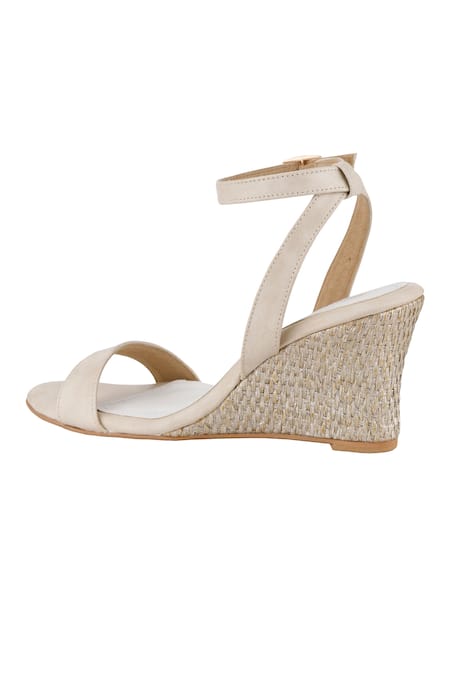 Buy White Ankle Strap Wedge Heels by Signature Sole Online at Aza Fashions.