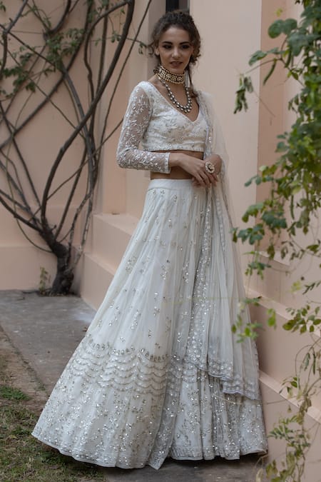 Shop Astha Narang White Main Material Netlining Semi Crepe V Neck Embroidered Lehenga Set at Aza Fashions Shop_Astha Narang_White Main Material Netlining Semi Crepe V Neck Embroidered Lehenga Set _at_Aza_Fashions