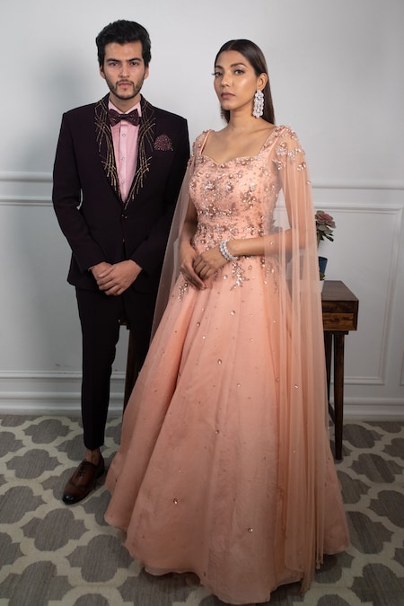 Photo of Couple on the reception with bride in a green lehenga