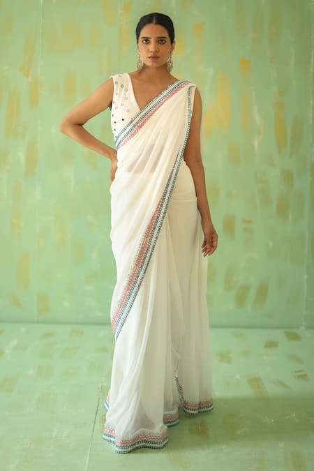 Enchanting Charm - Cream and Blue Muslin Saree with Mirror Work and Scallop  Border – Label by Saloni