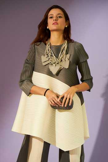 Tasuvure_Black Pleated Fabric Round Ariana Asymmetric Tunic And Flared Pant Set_at_Aza_Fashions