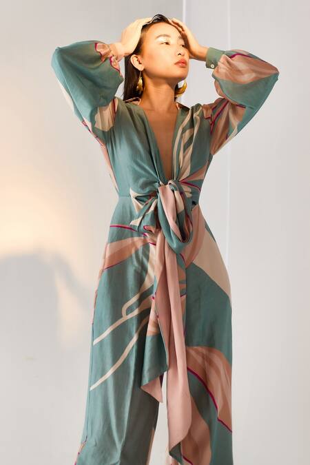 Twinkle Hanspal_Blue Chanderi Floral Plunge Neck Printed Tie Up Jumpsuit _Online_at_Aza_Fashions