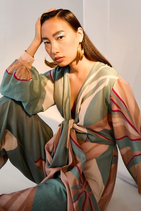 Twinkle Hanspal_Blue Chanderi Floral Plunge Neck Printed Tie Up Jumpsuit _at_Aza_Fashions