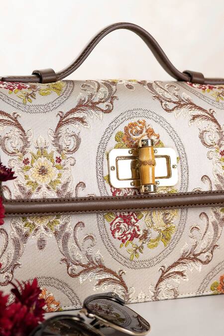 The Leather Garden White Floral Flap Sling Bag at Aza Fashions The Leather Garden_White Floral Flap Sling Bag _at_Aza_Fashions