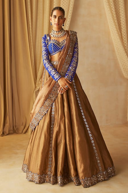 Gold bridal lehenga with heavy flared bottom and two dupattas – Ricco India