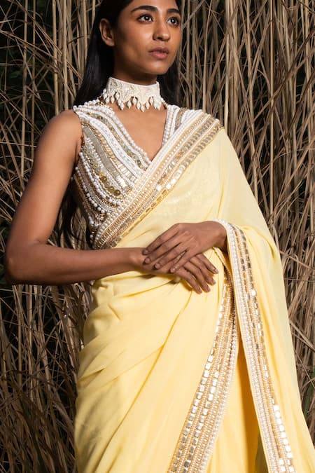 Shop_Saksham & Neharicka_Yellow Georgette Sequin And Pearl Embroidered Saree With Unstitched Blouse Piece_Online_at_Aza_Fashions