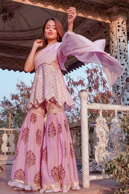 Buy Yuvraani Jaipur Pink Muslin, Shantoon Asymmetric Draped Tunic And Sharara Set Online at Aza Fashions Buy_Yuvraani Jaipur_Pink Muslin, Shantoon Asymmetric Draped Tunic And Sharara Set_Online_at_Aza_Fashions