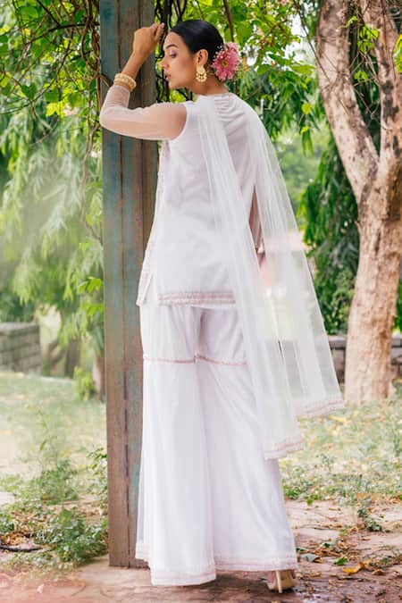 Shop Tarini Vij White Net Lining Satin Sequin, Cutdana And Resham Embroidered Kurta Sharara Set at Aza Fashions Shop_Tarini Vij_White Net Lining Satin Sequin, Cutdana And Resham Embroidered Kurta Sharara Set _at_Aza_Fashions