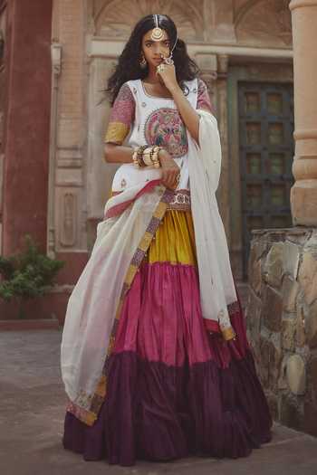 Off white cotton chanderi multi-tiered kurta dress set with 3/4 sleeves, highlighted with red & black quilted embroidered yoke in front and back.