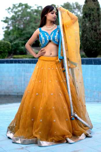 THE COPPER ORGANZA RECEPTION LEHENGA BY TANU KHERA DESIGNS main image 1