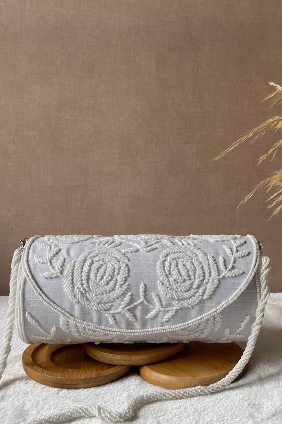 Kreivo by Vamanshi Damania Silk Cutdana Embellished Round Bag