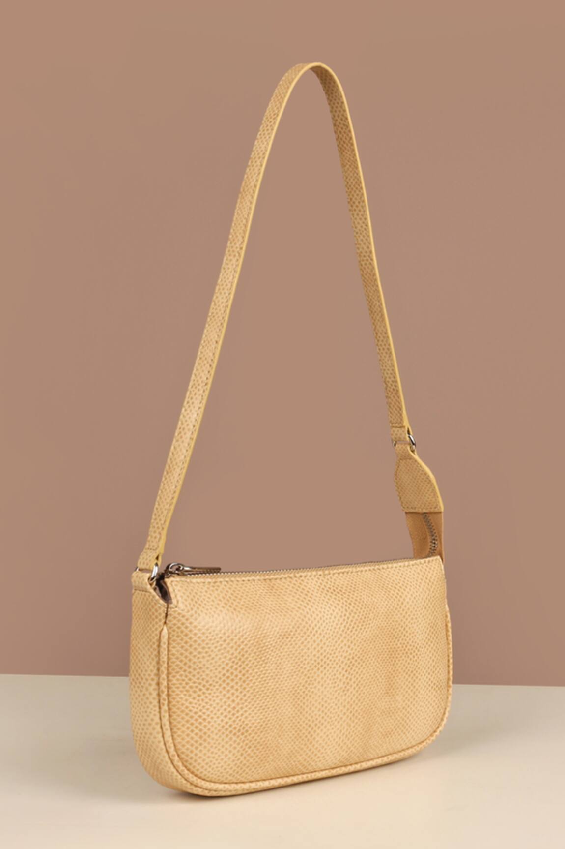 The House of Ganges Daily Curved Shape Solid Sling Bag