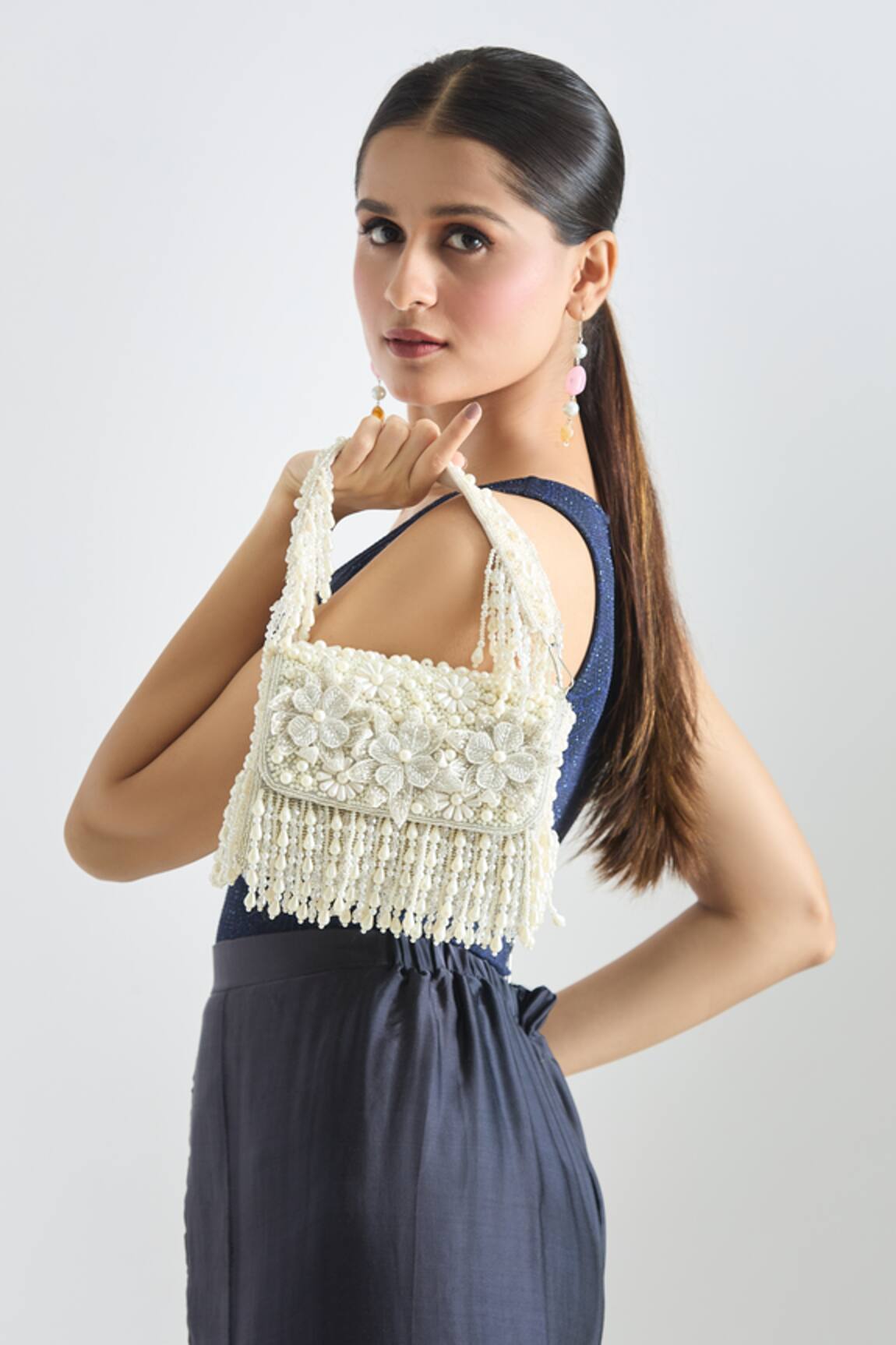 Tasna Flower Embossed Clutch