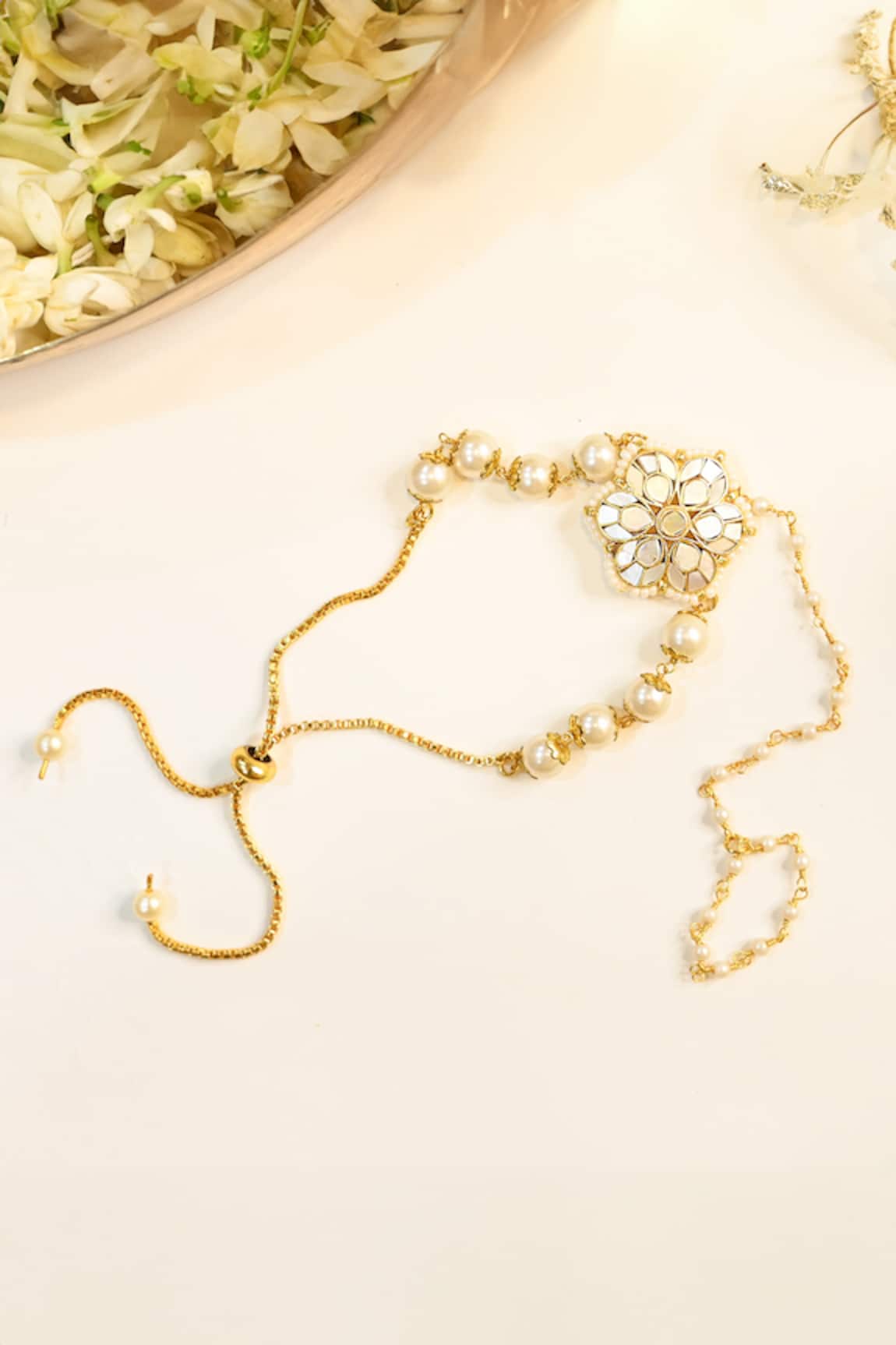 Shlok Jewels Floral Rakhi with Mother Of Pearl 