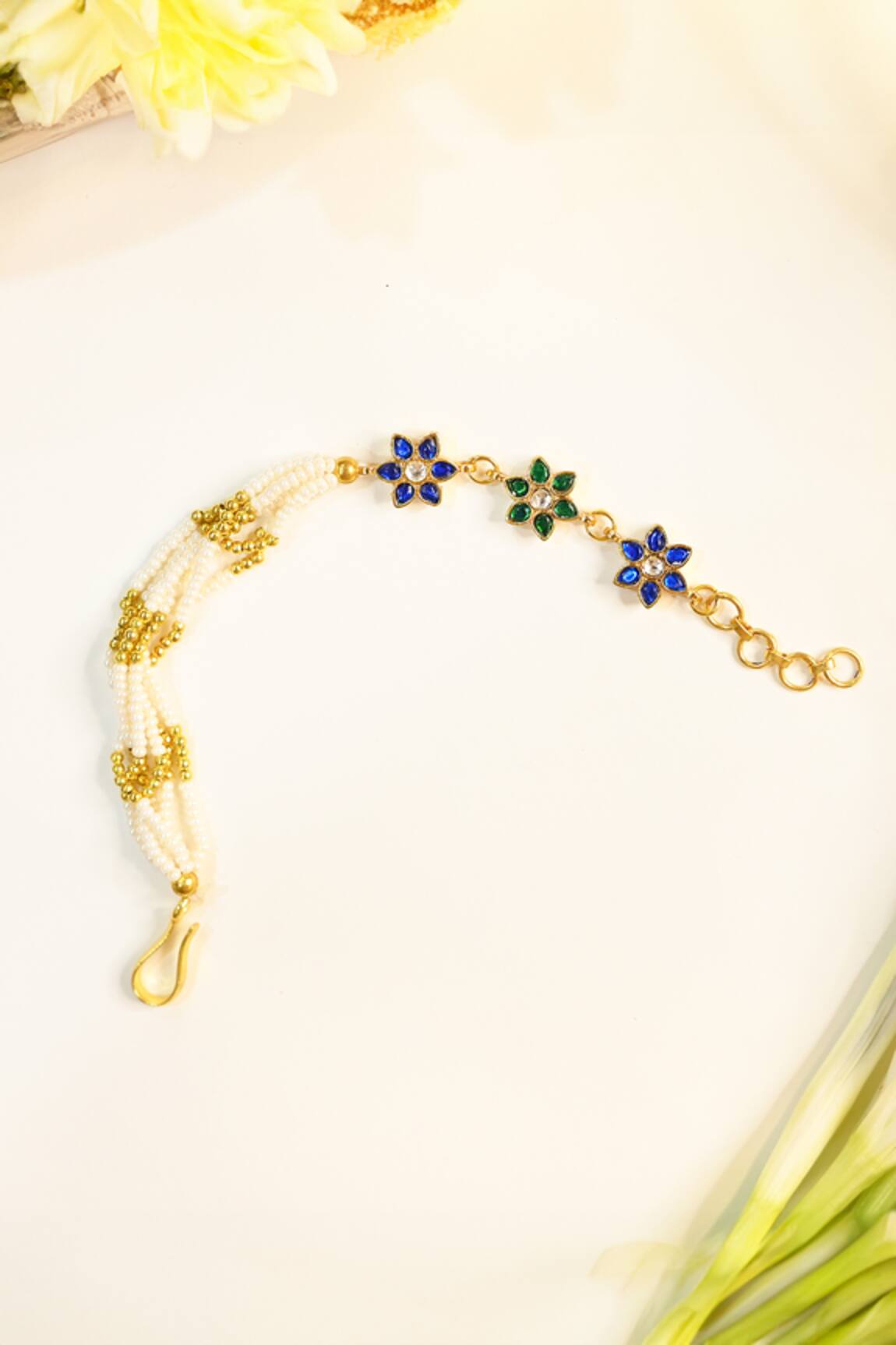 Shlok Jewels Floral Gemstone Pearl Rakhi 