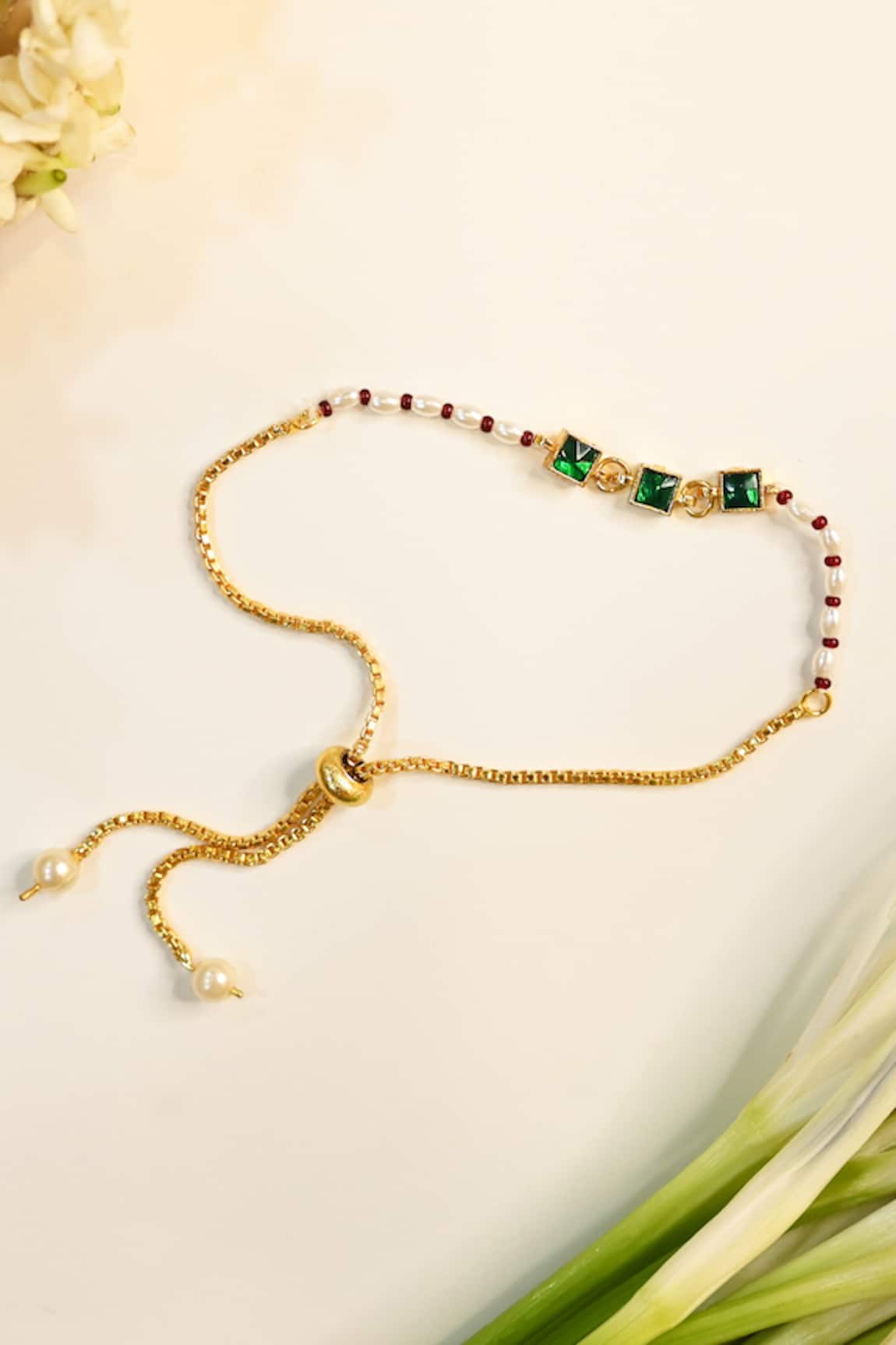 Shlok Jewels Floral Rakhi with Gemstone Embellishments 