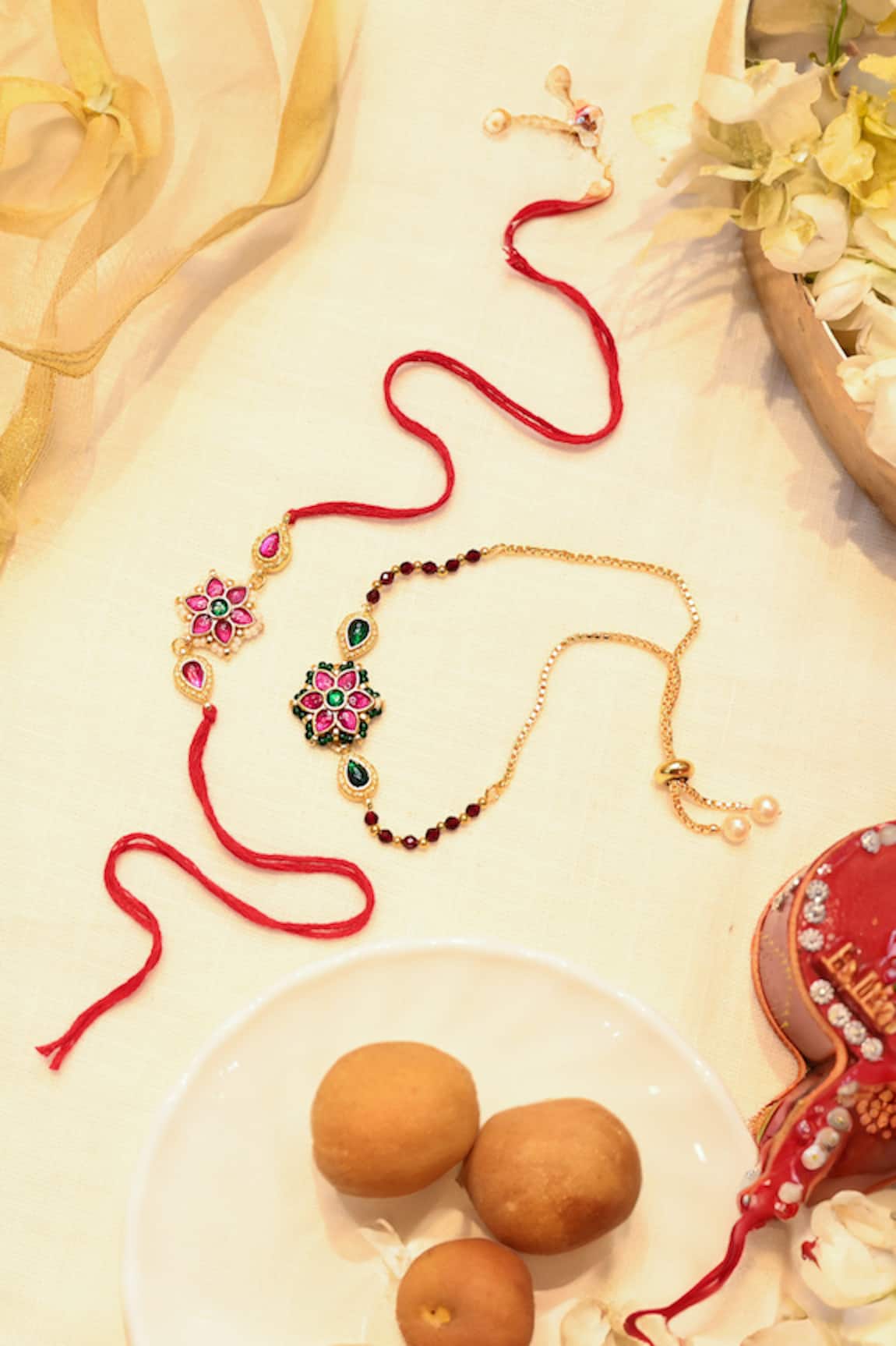 Shlok Jewels Kundan Embellished Lumba & Rakhi Set 