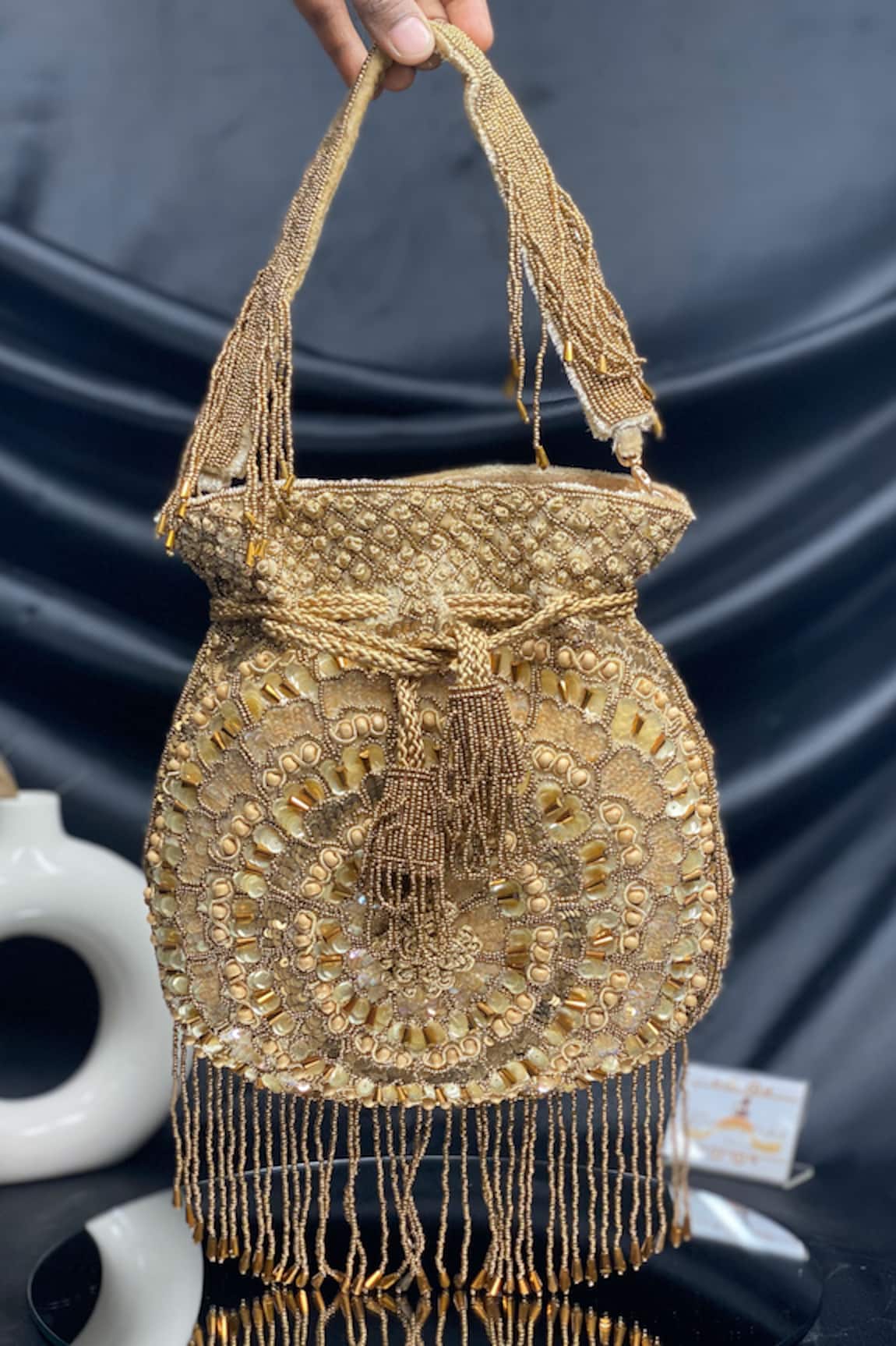 Kainiche by Mehak Gold Embellished Raw Silk Potli 