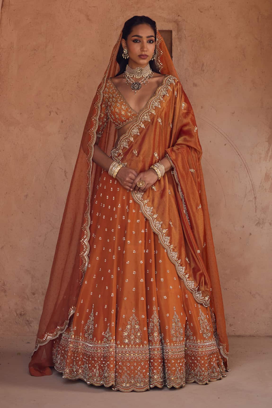 Kritika Dawar Rust Orange Embroidered Lehenga Set 