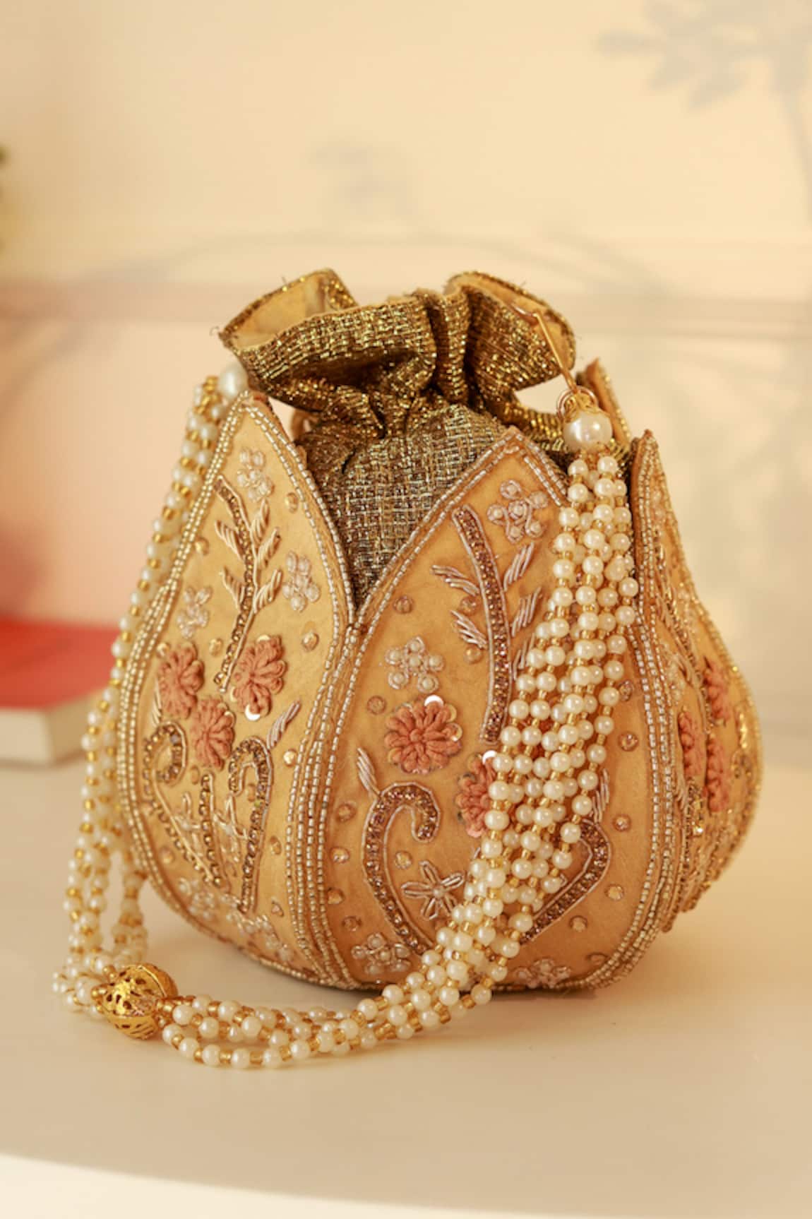 The Tan Clan Baag Gold Lotus Potli 