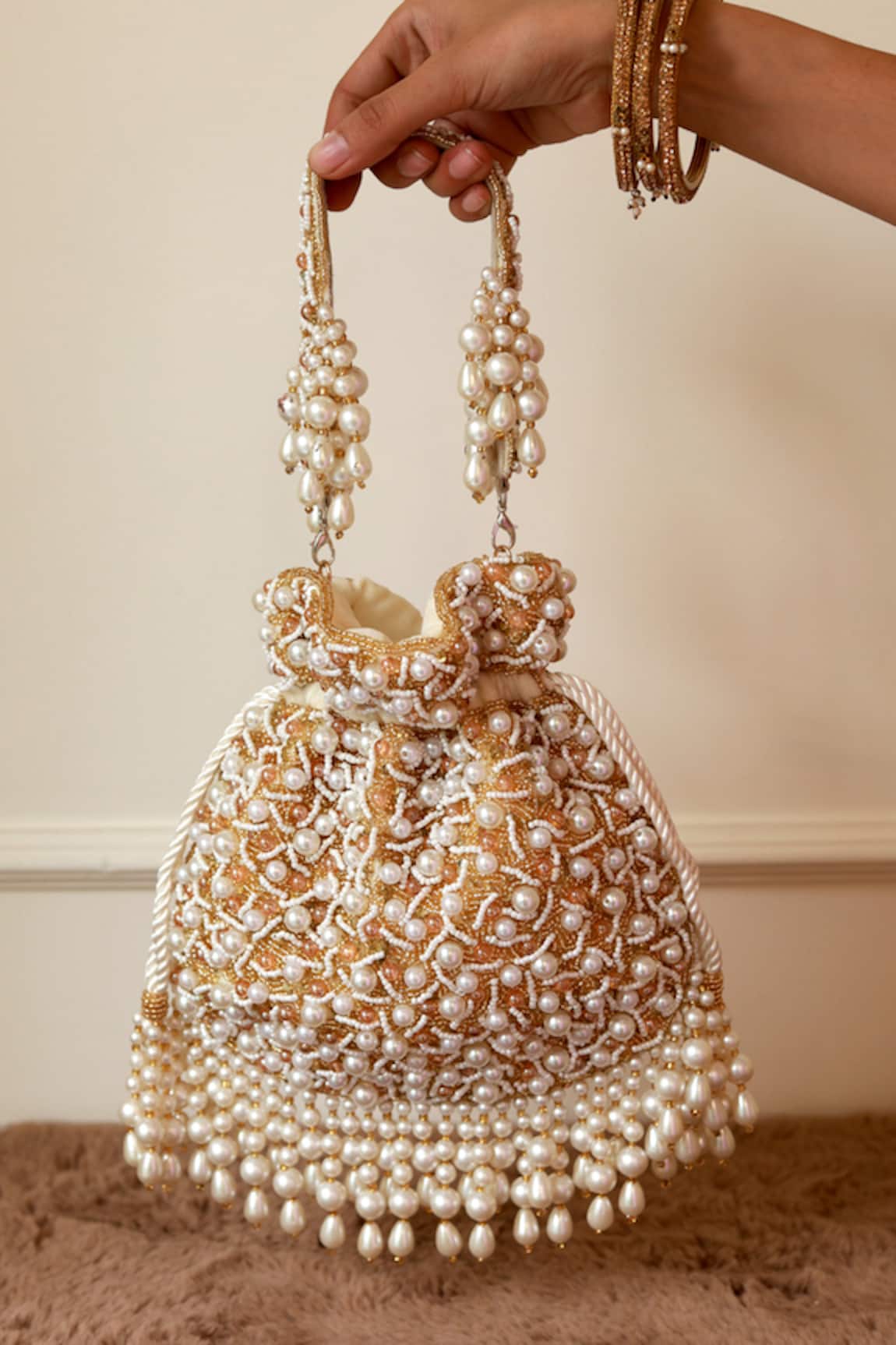 The Tan Clan Rimsha Pearl Potli Bag with Tassels 