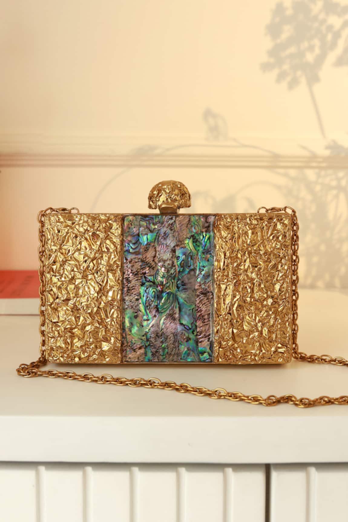 The Tan Clan Riddhi Brass Clutch 
