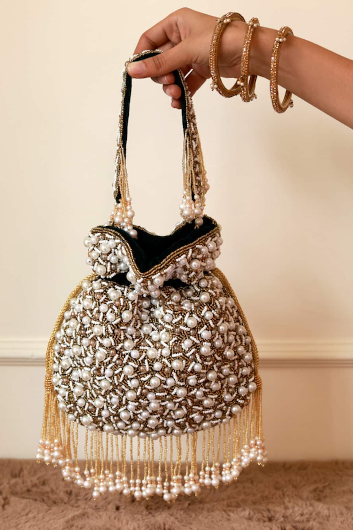 The Tan Clan Rimsha Pearl Potli Bag with Tassels 