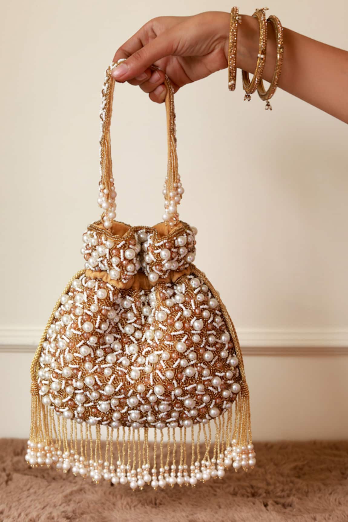 The Tan Clan Rimsha Pearl Potli Bag with Tassels 