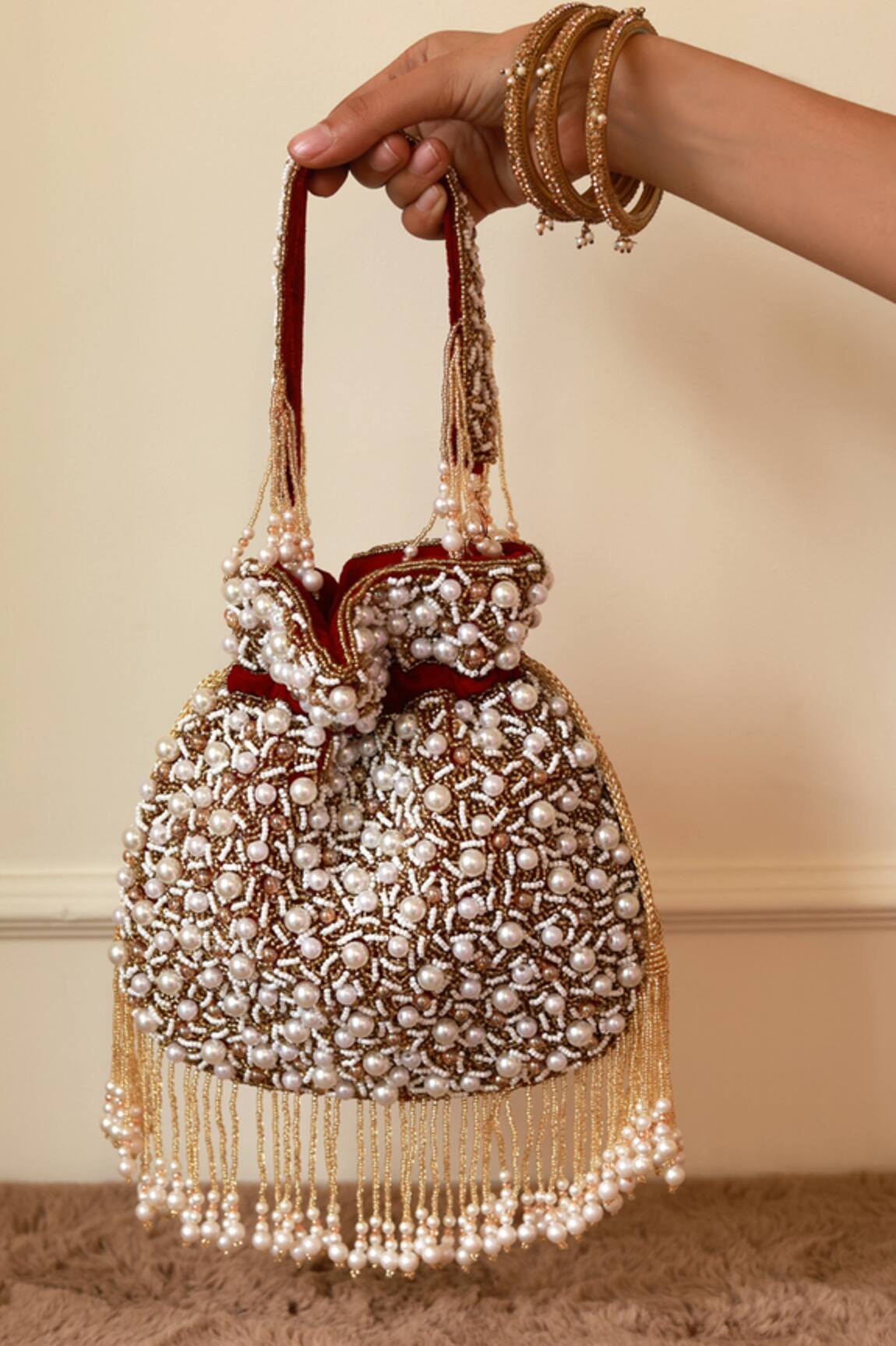 The Tan Clan Rimsha Pearl Potli Bag with Tassels 